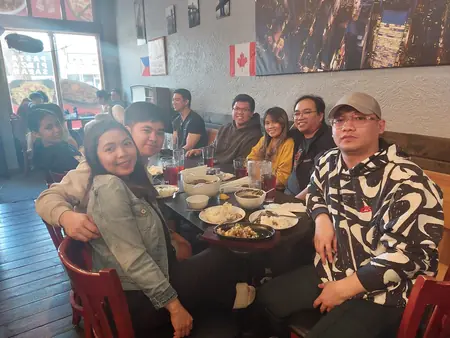 Guests sharing a meal at Kuya Will's restaurant in Lethbridge