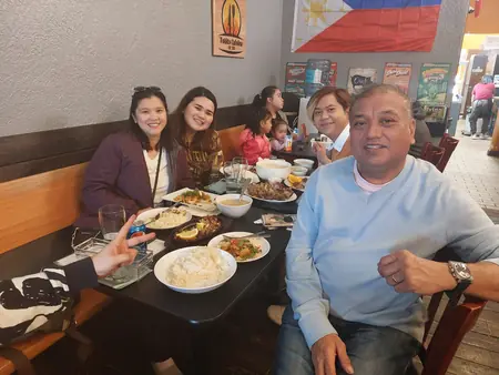 Guests sharing a meal at Kuya Will's restaurant in Lethbridge