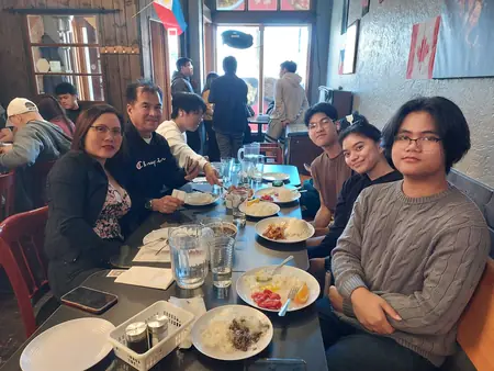 Guests sharing a meal at Kuya Will's restaurant in Lethbridge