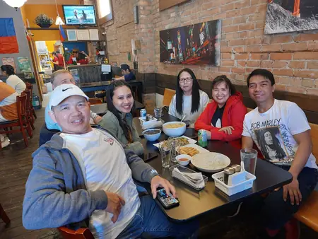 Guests sharing a meal at Kuya Will's restaurant in Lethbridge
