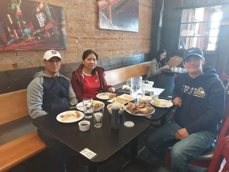 Guests sharing a meal at Kuya Will's restaurant in Lethbridge